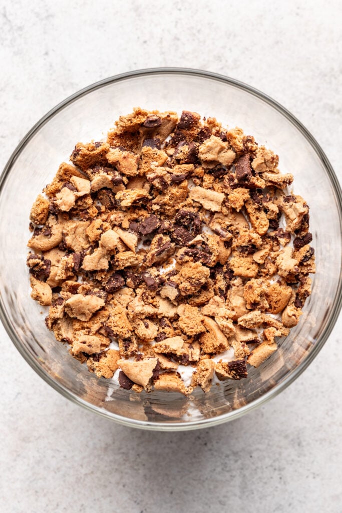 crumbled chocolate chip cookies in a trifle dish