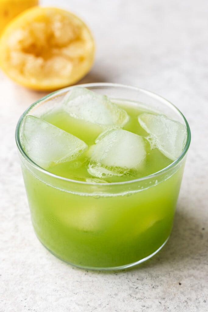 green juice in a class with ice