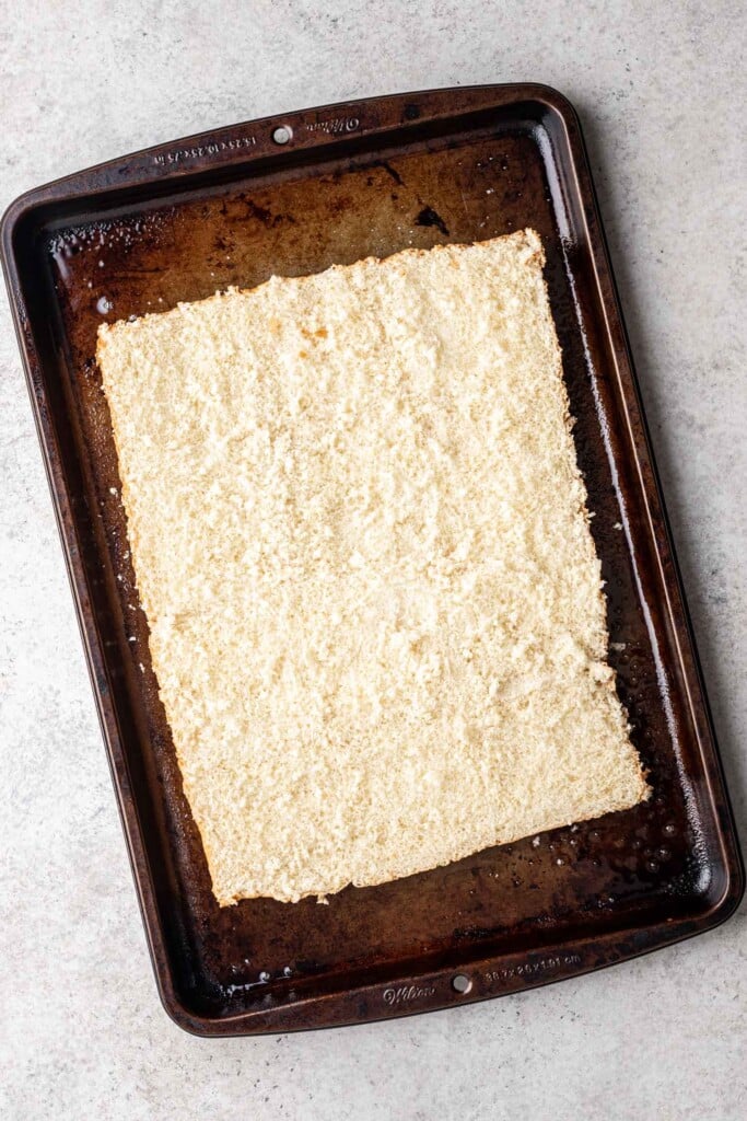 bottom half of slider buns on a sheet pan