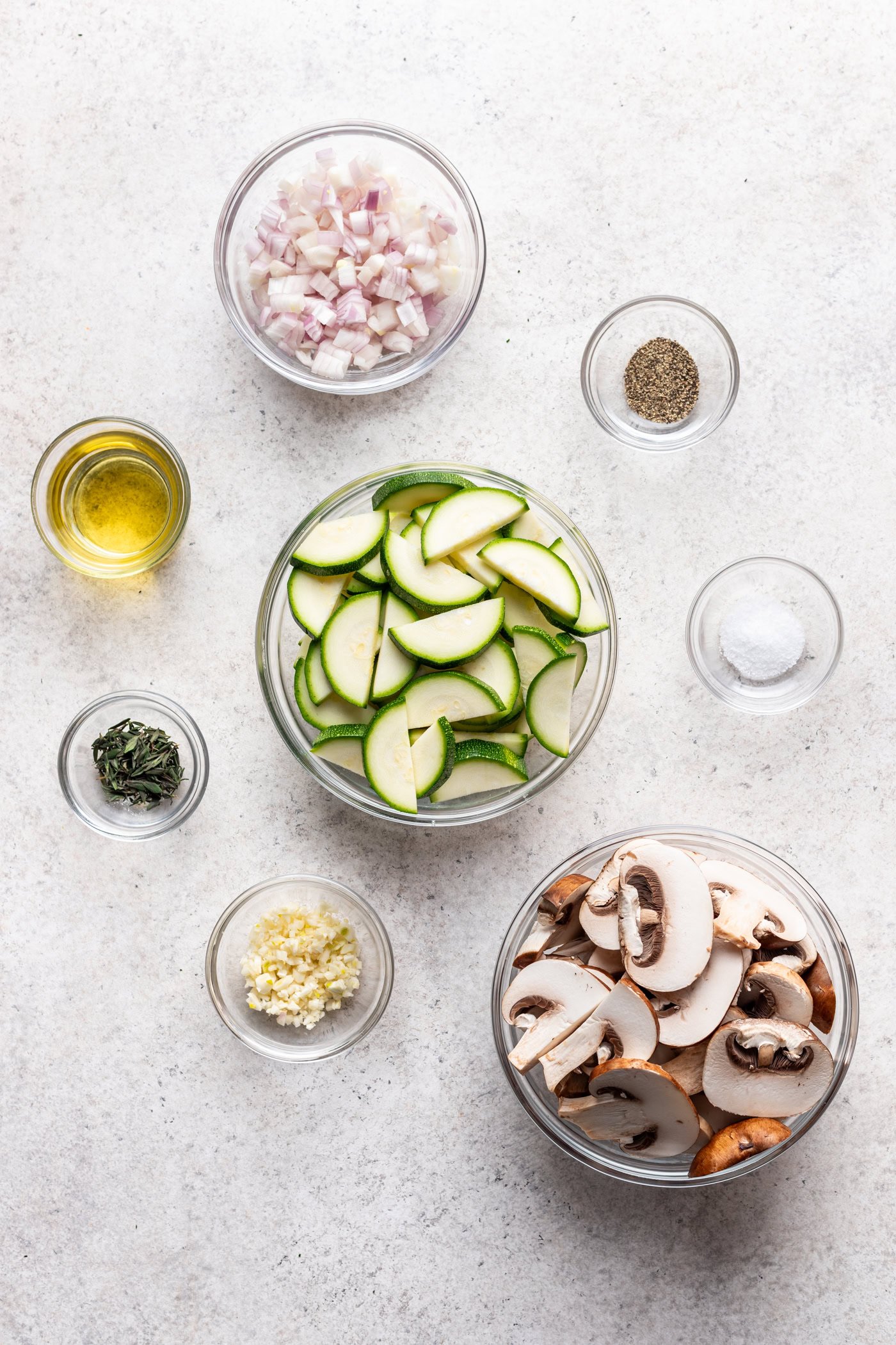 bowls of ingredients on a grey background
