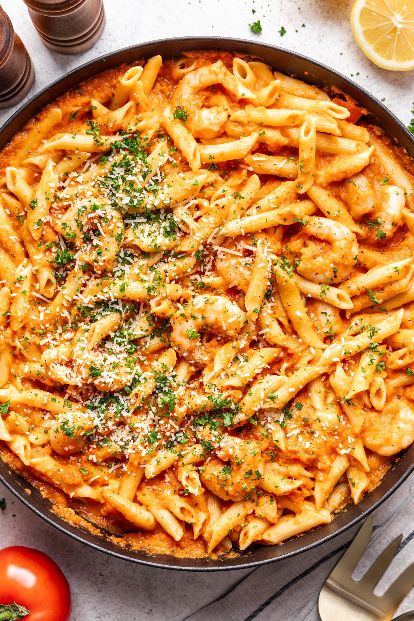 large pan of pasta and shrimp with red sauce