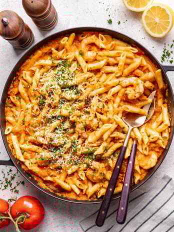 large bowl of pasta with 2 serving spoons