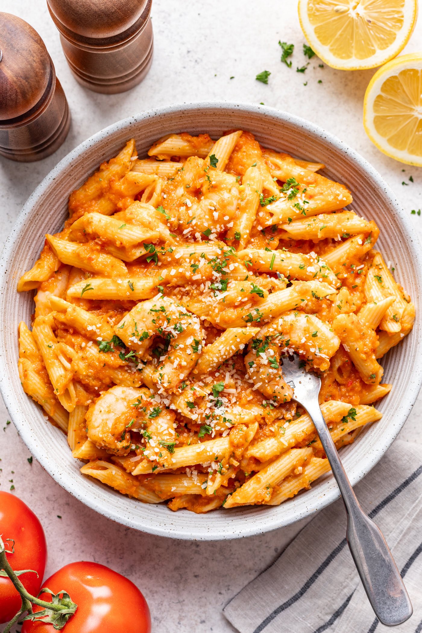 white bowl with pasta and shrimp