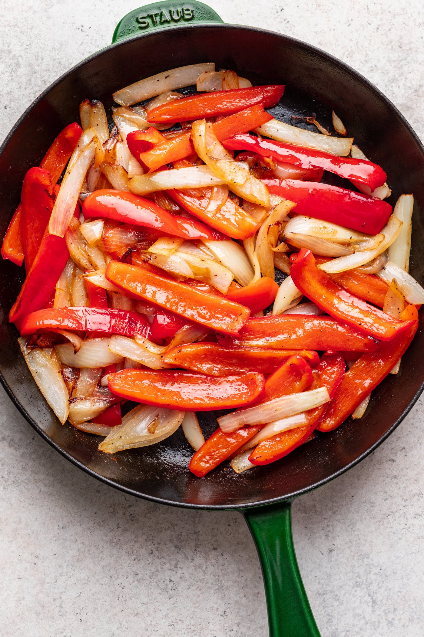 cast iron pan with peppers and onions