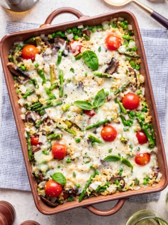 baked orzo and veggies with melted cheese on top