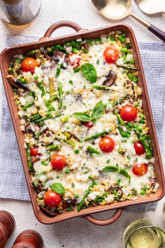 baked orzo and veggies with melted cheese on top