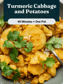 A bowl of turmeric cabbage and potato slices garnished with fresh cilantro, with a fork resting in the bowl. A lemon wedge and herbs are placed nearby on a light surface. Text overlay reads: Turmeric Cabbage and Potatoes.