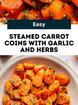 Close-up of sliced steamed carrots topped with chopped garlic and fresh herbs served in a bowl, with a spoon beside the carrots. Text overlay reads: Easy Steamed Carrot Coins with Garlic and Herbs.