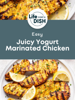 Grilled chicken breasts with visible grill marks, garnished with lemon wedges and herbs, served on white plates. Text overlay says “Easy Juicy Yogurt Marinated Chicken” by Life is but a Dish.
